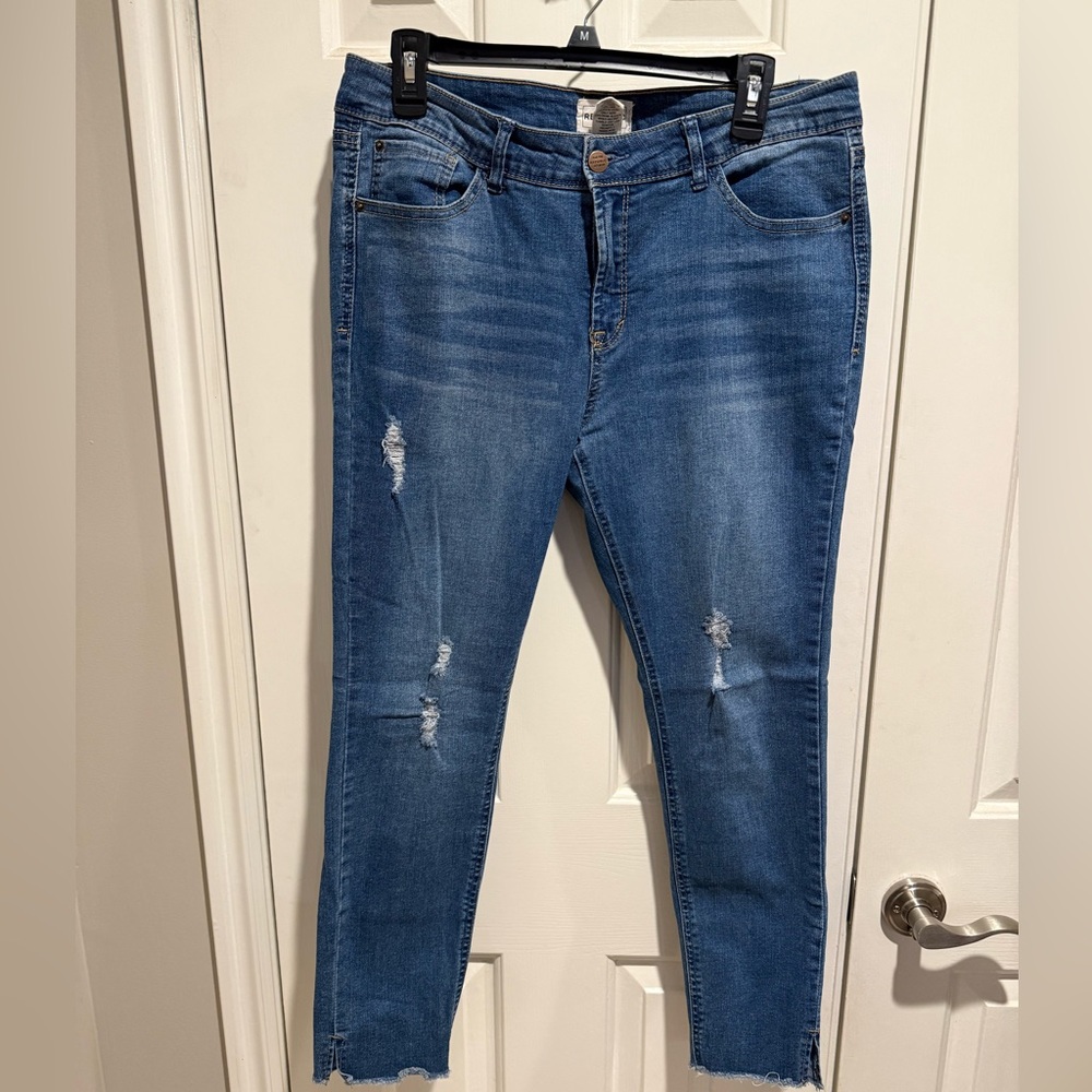 Distressed denim jeans